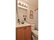 This bathroom features a wood vanity, framed mirrors, and a shower with tub at 1119 Wild Oak Ter, Deland, FL 32720