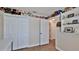 Bedroom with a double door closet and decor shelves filled with keepsakes at 1119 Wild Oak Ter, Deland, FL 32720