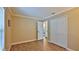 Open bedroom with wood floors and closet doors at 1119 Wild Oak Ter, Deland, FL 32720