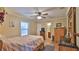 Bedroom featuring a wood bed, bedside bureau, and a window offering ample natural light at 1119 Wild Oak Ter, Deland, FL 32720
