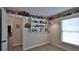 Bedroom featuring wall shelves and a window offering natural light at 1119 Wild Oak Ter, Deland, FL 32720