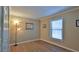 Empty bedroom featuring a window, wood-look floors, and ample space at 1119 Wild Oak Ter, Deland, FL 32720