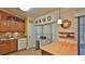 Well-lit kitchen area with wooden cabinets, ample counter space, and modern appliances at 1119 Wild Oak Ter, Deland, FL 32720
