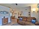 Open-concept living room flows into dining area, featuring comfortable seating and natural light at 1119 Wild Oak Ter, Deland, FL 32720