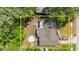 Aerial view of property with mature trees, defined lot lines, and one car parking in driveway at 126 Brandy Hills Dr, Port Orange, FL 32129