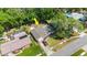 High-angle aerial view of a home with a driveway, pool, and a fenced-in backyard at 126 Brandy Hills Dr, Port Orange, FL 32129