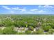 Aerial view of a residential neighborhood surrounded by lush trees. Yellow arrow indicates home location at 126 Brandy Hills Dr, Port Orange, FL 32129