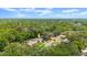 Aerial view of a residential neighborhood surrounded by lush trees. Yellow arrow indicates home location at 126 Brandy Hills Dr, Port Orange, FL 32129