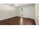 Bedroom with hardwood floors, neutral paint, and ample closet space at 126 Brandy Hills Dr, Port Orange, FL 32129