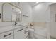 Bathroom featuring white cabinets, marble floors, and a bathtub at 1371 Melonie Trl, New Smyrna Beach, FL 32168