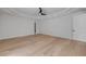 Bedroom with hardwood floors, a tray ceiling, and crown molding at 1371 Melonie Trl, New Smyrna Beach, FL 32168