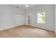 Bright bedroom with hardwood floors, a window, and closet at 1371 Melonie Trl, New Smyrna Beach, FL 32168
