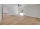 Bright bedroom boasts wood floors and sliding glass doors to the backyard at 1371 Melonie Trl, New Smyrna Beach, FL 32168