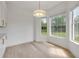 Sunny dining area featuring ample natural light and a modern chandelier at 1371 Melonie Trl, New Smyrna Beach, FL 32168