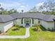 Beautiful single-story home with well-manicured lawn and elegant front entrance at 1371 Melonie Trl, New Smyrna Beach, FL 32168