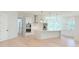 New kitchen featuring an island, stainless appliances, white cabinets, and wood floors at 1371 Melonie Trl, New Smyrna Beach, FL 32168