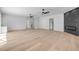 Living room with hardwood floors, ceiling fans, and a modern fireplace at 1371 Melonie Trl, New Smyrna Beach, FL 32168