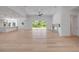 Open-concept living area with sleek hardwood floors and lots of natural light that offers amazing views at 1371 Melonie Trl, New Smyrna Beach, FL 32168