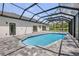 Relaxing screened-in pool area with brick pavers, ideal for outdoor living at 1371 Melonie Trl, New Smyrna Beach, FL 32168