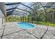 A beautiful pool with a screened lanai, providing an ideal space for relaxation and outdoor enjoyment at 1371 Melonie Trl, New Smyrna Beach, FL 32168