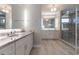 Bright bathroom with double vanity, walk-in shower, and linen closet at 1787 Earhart Ct, Port Orange, FL 32128