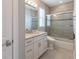 Bright bathroom features a vanity with drawers and a shower-tub combo at 1787 Earhart Ct, Port Orange, FL 32128