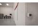 Garage wall featuring a thermostat for climate control and view of the garage workspace at 1787 Earhart Ct, Port Orange, FL 32128