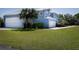 Exterior angled shot of an oversized detached garage with a two car garage at 1787 Earhart Ct, Port Orange, FL 32128