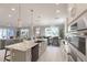 Open-concept kitchen with stainless steel appliances and a view of the dining and living area at 1787 Earhart Ct, Port Orange, FL 32128