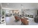 Large living room with modern decor open to the dining area and kitchen with an open floor plan at 1787 Earhart Ct, Port Orange, FL 32128