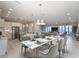 Open floor plan with kitchen, dining, and living room featuring modern decor and plenty of natural light at 1787 Earhart Ct, Port Orange, FL 32128