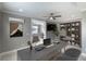 Home office featuring an executive desk, built-in bookshelf, and ceiling fan at 1787 Earhart Ct, Port Orange, FL 32128
