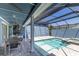 Outdoor kitchen and patio area with swimming pool at 1787 Earhart Ct, Port Orange, FL 32128