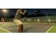 Nighttime view of people playing a pickleball match at Spruce Creek Country Club at 1787 Earhart Ct, Port Orange, FL 32128