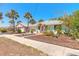 Well-maintained home with a tidy front yard, a quaint front porch, and mature palm trees at 208 Crawford Rd, New Smyrna Beach, FL 32169
