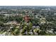 Aerial view of the surrounding neighborhood with established trees shows this property surrounded by other homes at 2204 Kumquat Dr, Edgewater, FL 32141