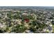 Aerial view of the surrounding neighborhood with established trees shows this property at 2204 Kumquat Dr, Edgewater, FL 32141