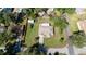 A wide shot of the property, showing the house, the boat in the backyard and the large fenced yard at 2204 Kumquat Dr, Edgewater, FL 32141