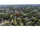 Aerial view of the surrounding neighborhood with established trees shows this property from high above at 2204 Kumquat Dr, Edgewater, FL 32141