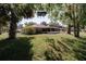 Lush backyard with mature trees, providing ample shade and privacy for outdoor enjoyment at 2204 Kumquat Dr, Edgewater, FL 32141