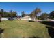 Expansive backyard with lush green grass, offering plenty of space for outdoor activities and recreation at 2204 Kumquat Dr, Edgewater, FL 32141