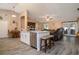 Open kitchen area with island, stainless steel dishwasher and views of the dining and living areas at 2204 Kumquat Dr, Edgewater, FL 32141