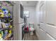 Functional laundry room featuring a stacked washer and dryer with a utility sink at 2204 Kumquat Dr, Edgewater, FL 32141