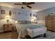 Comfortable main bedroom with a king-sized bed, ceiling fan, and soothing wall colors at 2204 Kumquat Dr, Edgewater, FL 32141