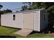Well-maintained outbuilding with a ramp, providing extra storage space on the property at 2204 Kumquat Dr, Edgewater, FL 32141