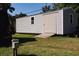 Durable storage shed with ramp, perfect for storing tools and equipment in the backyard at 2204 Kumquat Dr, Edgewater, FL 32141