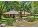 Charming brick home with well-manicured lawn and inviting front entrance at 32030 Dewberry Ln, Sorrento, FL 32776