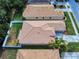 Aerial view showcases fenced yard, landscape, and the nearby neighborhood at 3455 Pegaso Ave, New Smyrna Beach, FL 32168