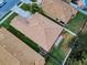 Aerial view of a single-Gathering house featuring a well-maintained lawn and a brown shingle roof at 3455 Pegaso Ave, New Smyrna Beach, FL 32168