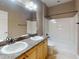 Bathroom with double sink vanity, bath tub and shower combo at 3455 Pegaso Ave, New Smyrna Beach, FL 32168